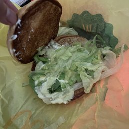 a sandwich with lettuce and a donut