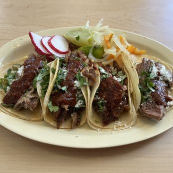 Burritos Express - Four tacos, carnitas on the left, birria on the right, al pastor in the middle.  All super delicious!!! - Latin American Near Me - Paso Robles, California