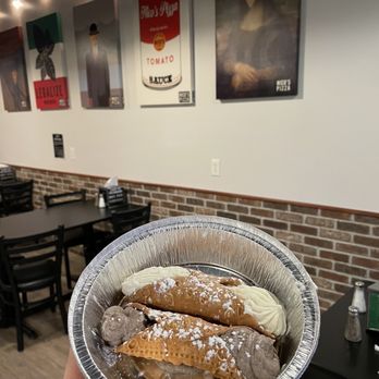 Nico's Pizza - a person holding a plate of food - Pizza Near Me - Provo, Utah Nico's Pizza - a person holding a plate of food - Pizza Near Me - Provo, Utah