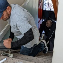 Next Level Accessibility - Anthony & Mike working on the installation.