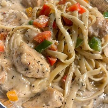 Thyme After Time - a plate of pasta with chicken and vegetables - Soul Food Near Me - Charleston, West Virginia