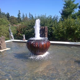 Fountain in beautiful backyard area Fountain in beautiful backyard area