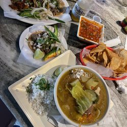 Soup, taco trio, carne asada taco, Jarritos and Modelo beer.