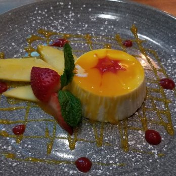 Limon - Panna Cotta de Mango: chilled sweet cream dessert topped with fresh fruit & a drizzle of housemade strawberry & mango sauces ($9.95) - Tapas/Small Plates Near Me - Burlingame, California