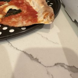 Too short of a cool time. Crust did not have time to cook and/or dough was prep the same day