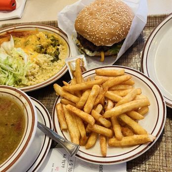 Frontier - L-R Chicken enchilada with Christmas sauce, Frontier cheeseburger, bean and cheese burrito. Fries and green chile stew - Mexican Near Me - Albuquerque, New Mexico