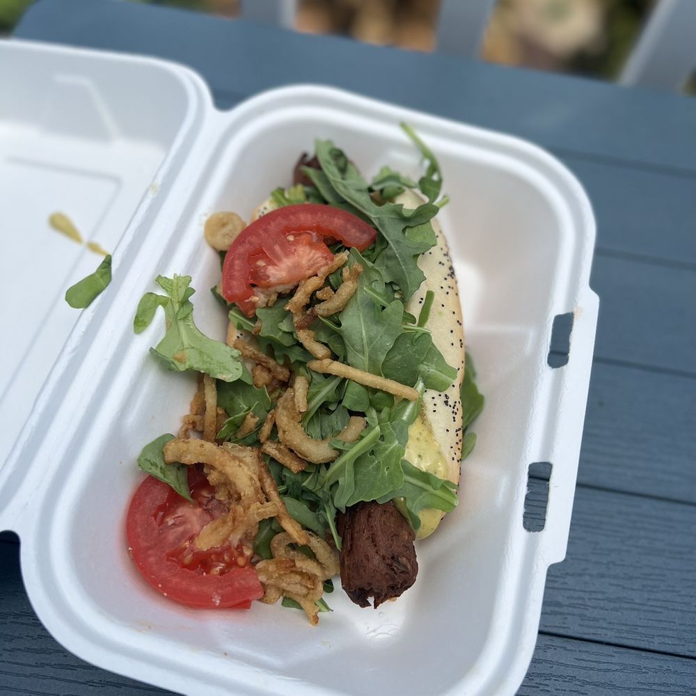 DogSlinger - Water and Wheat Chicken Sausage as a Cali: arugula, tomato slices, spicy basil aioli, avocado slices, and crispy onion strips. TEN STARS!!! - Hot Dogs Near Me - Stevensville, Michigan DogSlinger - Water and Wheat Chicken Sausage as a Cali: arugula, tomato slices, spicy basil aioli, avocado slices, and crispy onion strips. TEN STARS!!! - Hot Dogs Near Me - Stevensville, Michigan