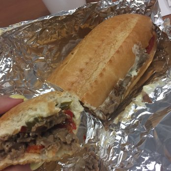 Philly Steak & Wings - cheese steak with american cheese, onions, peppers, mushrooms. delicious - Sandwiches Near Me - Mesa, Arizona