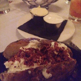 Delmonico's Steakhouse - This loaded baked potato was next level good! - Steakhouses Near Me - Independence, Ohio Delmonico's Steakhouse - This loaded baked potato was next level good! - Steakhouses Near Me - Independence, Ohio