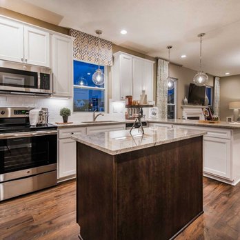 MI Homes - a kitchen with white cabinets and stainless steel appliances - General Contractors Near Me - Columbus, Ohio MI Homes - a kitchen with white cabinets and stainless steel appliances - General Contractors Near Me - Columbus, Ohio