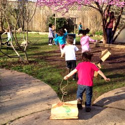Inman Park Cooperative Preschool - Exploring in the Outdoor Classroom. 60% of the school day is spent outside.