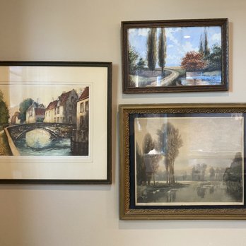 Fiddleheads Coffee - a couple of paintings hanging on a wall - Coffee & Tea Near Me - Cedarburg, Wisconsin
