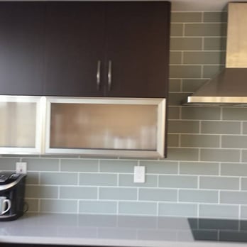 Barry's Kitchens - a modern kitchen with stainless steel appliances - Cabinetry Near Me