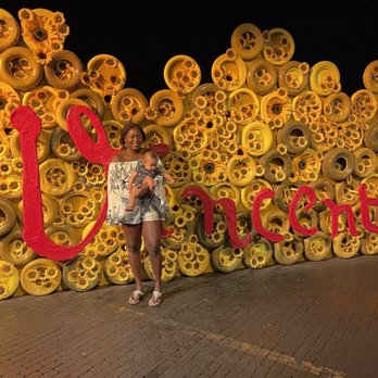Immersive Van Gogh - Charlotte - "Vincent" written on sunflower wall art - Art Galleries Near Me - Charlotte, North Carolina