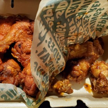Wingstop - The one on the left is original hot. The one on the right is atomic hot. The atomic wings are seriously less hot than the original. - Chicken Wings Near Me - Las Vegas, Nevada Wingstop - The one on the left is original hot. The one on the right is atomic hot. The atomic wings are seriously less hot than the original. - Chicken Wings Near Me - Las Vegas, Nevada