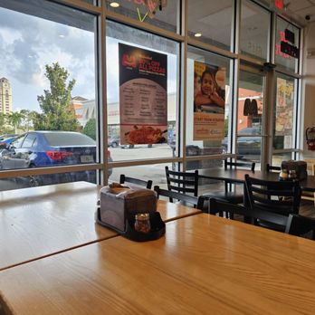 Marco's Pizza - Parking lot view, from furthest seat. Have three tables/ 4 seats and two tables/2 seats total capacity - Chicken Wings Near Me - Orlando, Florida Marco's Pizza - Parking lot view, from furthest seat. Have three tables/ 4 seats and two tables/2 seats total capacity - Chicken Wings Near Me - Orlando, Florida