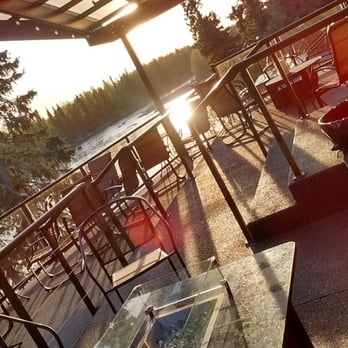 Bridge Lounge - a view of the sun setting over the water - Lounges Near Me - Soldotna, Alaska Bridge Lounge - a view of the sun setting over the water - Lounges Near Me - Soldotna, Alaska