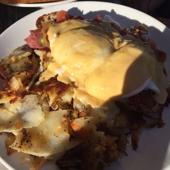Cafe M - Irish Eggs Benedict with corned beef, sautéed onions and the fixings. Nice crisp potatoes. - Breakfast & Brunch Near Me - Berkeley, California