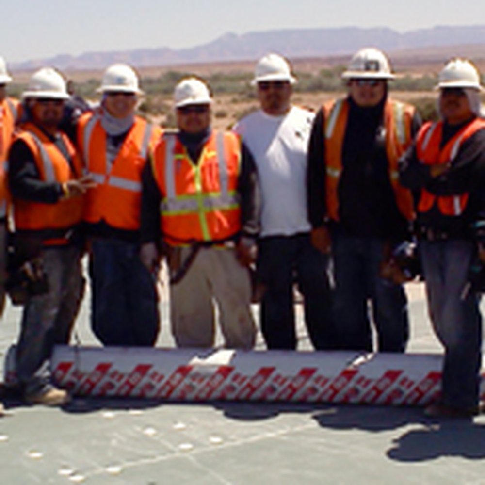 Asta Roofing & Construction - a group of men in orange vests and hard hats - Roofing Near Me - Winslow, Arizona