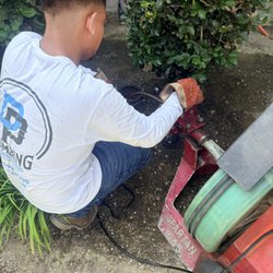 DP Plumbing - Clearing clogged sewer drain with snake