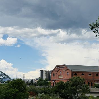 Sentral Union Station - REI at Platte River/Cherry Creek Confluence facing west towards mountains - Apartments Near Me - Denver, Colorado Sentral Union Station - REI at Platte River/Cherry Creek Confluence facing west towards mountains - Apartments Near Me - Denver, Colorado