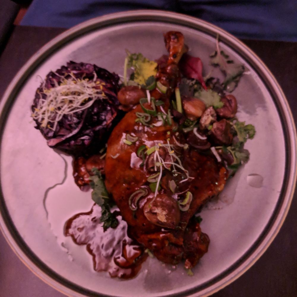 Le Voyage - Duck leg, with lentils, red cabbage and chestnuts in a black pepper beer sauce - Asian Fusion Near Me - Munich, BY