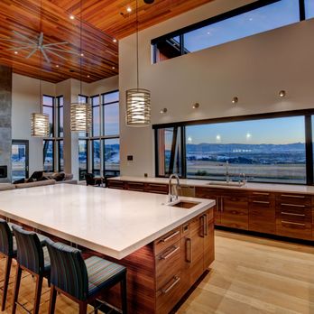 Tyler Electric - Custom kitchen and living room lighting with layered design: hanging island lights, wall accents, and recessed ceiling illumination. - Electricians Near Me - Bozeman, Montana Tyler Electric - Custom kitchen and living room lighting with layered design: hanging island lights, wall accents, and recessed ceiling illumination. - Electricians Near Me - Bozeman, Montana