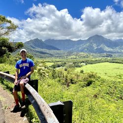 Hanalei Bay Lookout - I sat on the guardrail for a picture from Hanalei Bay Lookout.