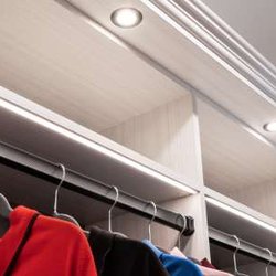 The Tailored Closet of South Jersey - With ample overhead lighting you'll never lose anything in your closet again. Lighting also makes it easier to distinguish co...