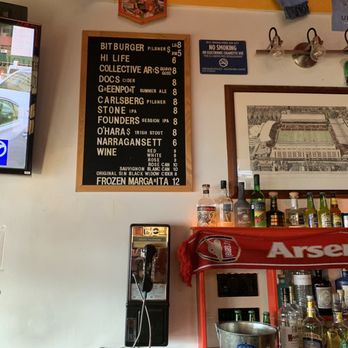 Highbury Pub - a bar with a menu on the wall - Pubs Near Me - New York, New York Highbury Pub - a bar with a menu on the wall - Pubs Near Me - New York, New York