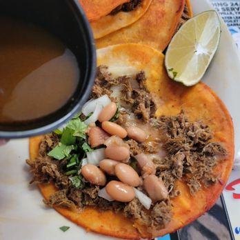 Arboledas Mexican Grill - Dripping the birria consumme broth onto taco. - Mexican Near Me - Rockwall, Texas Arboledas Mexican Grill - Dripping the birria consumme broth onto taco. - Mexican Near Me - Rockwall, Texas