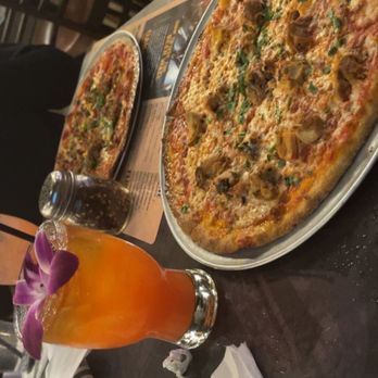 Oak & Stone - Cheese pizza topped with roasted chicken with O&S Rum Punch - Pizza Near Me - Bradenton, Florida