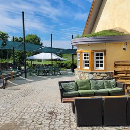 Looking beyond the patio and up to the rolling hills to the vines. Looking beyond the patio and up to the rolling hills to the vines.