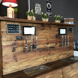 The Brasserie Resto & Bar - Our beer wall with six self-tap beer taps.