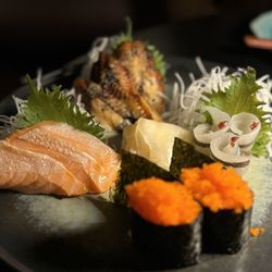 Kumoya - Salmon, unagi, and needlefish Sashimi. Smeltfish roe