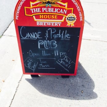 Canoe and Paddle - a sign on the sidewalk - British Near Me - Lakefield, Ontario Canoe and Paddle - a sign on the sidewalk - British Near Me - Lakefield, Ontario