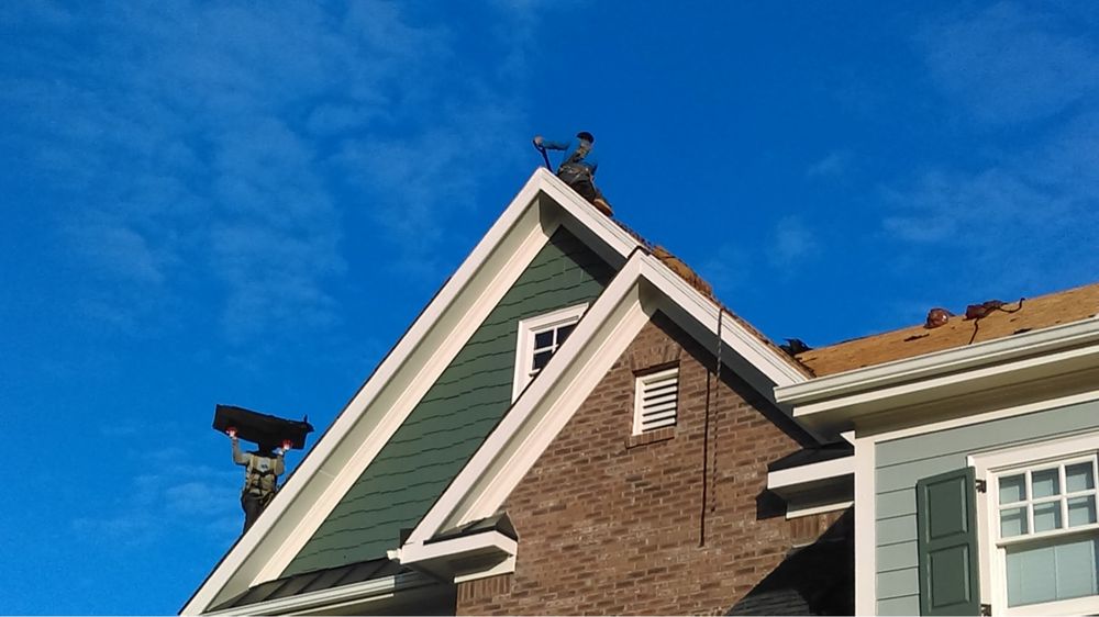 Slide of Goliath Roofing