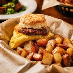 Crickles and Co - Buttermilk biscuit, sausage, egg and cheese. Served with skillet potatoes.