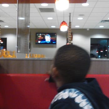 Burger King - a man and a boy sitting in a booth - Burgers Near Me - Missouri City, Texas