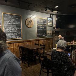 Farmers Gastropub - Nice fireplace in the corner and daily specials and beer board