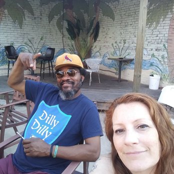 Office Lounge - a man and a woman sitting outside - Bars Near Me - Belleville, Illinois Office Lounge - a man and a woman sitting outside - Bars Near Me - Belleville, Illinois