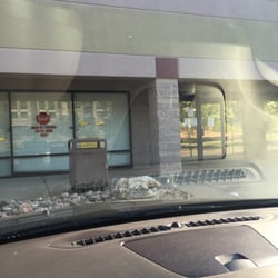 Colorado Drivers License Bureau - You have to use the side entrance. Website says open 7 am, but it only opens at 8 am.