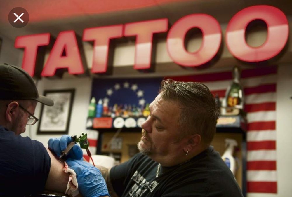 Patriotic Pain Tattoo & Body Piercing Logo