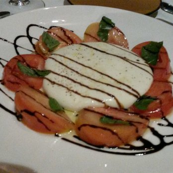 Dolce Italian - Caprese appetizer. In-House made served warm with heirloom tomatoes and balsamic vinegar. - Italian Near Me - Miami Beach, Florida