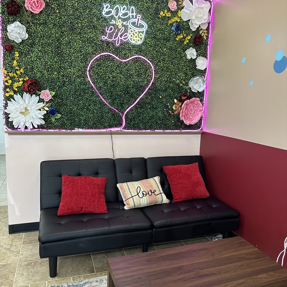 Boba Pop - a living room with a couch and a coffee table - Coffee & Tea Near Me - Siloam Springs, Arkansas Boba Pop - a living room with a couch and a coffee table - Coffee & Tea Near Me - Siloam Springs, Arkansas