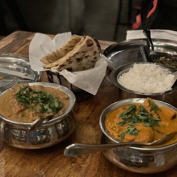 Ghee Indian Kitchen - Garlic Naan Kerala lamb (left) Chicken tikka masala (right) - Indian Near Me - Miami, Florida