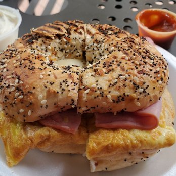 Le Diplomate Cafe - Egg, ham, and cheese on an everything bagel. Side of garlic mayo. Side of spicy thai chili. Excellent! - Bakeries Near Me - Irvine, California