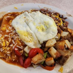 Mary's Restaurant - Breakfast cheese/onion enchiladas with over easy eggs and mild red sauce. Home fries and whole beans.