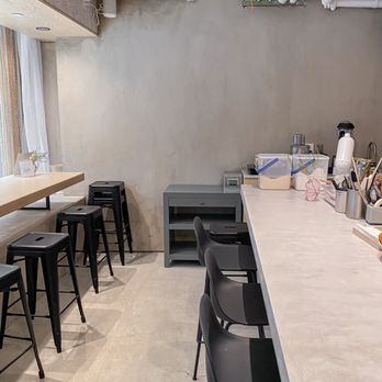 Miomio - a kitchen with a counter and chairs - Desserts Near Me - New York, New York