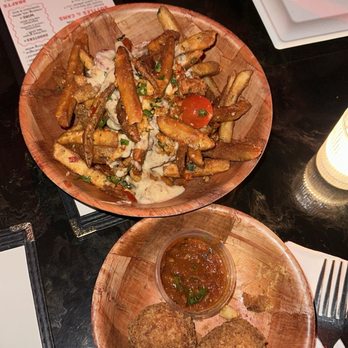 Donna’s - Parmesan fries and Mac n cheese balls. These were halfway eaten so it looks smaller but the portion is bigger than this. - Bars Near Me - Seattle, Washington Donna’s - Parmesan fries and Mac n cheese balls. These were halfway eaten so it looks smaller but the portion is bigger than this. - Bars Near Me - Seattle, Washington